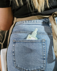 divi product in a pants back pocket of a hair stylist